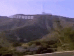 The Hollywood Sign Is On Top Of A Hill GIF