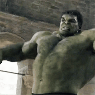 The Hulk Is Holding A Sword In His Hand And Looking At The Camera . GIF