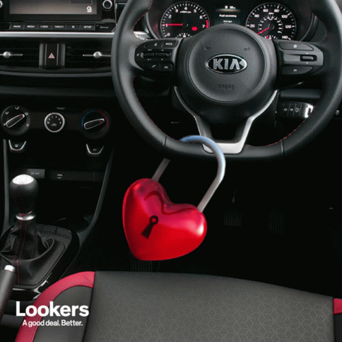 The Inside Of A Kia Car With A Heart Shaped Key GIF