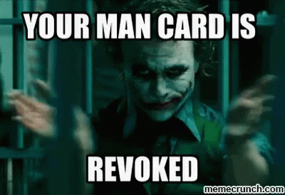The Joker From The Movie The Dark Knight Is Making A Funny Face While Holding His Hands Up . GIF