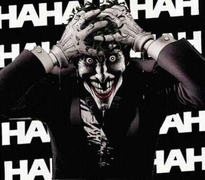 The Joker Is Laughing While Holding His Hands To His Face GIF