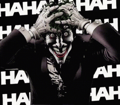 The Joker Is Making A Funny Face With His Hands On His Face GIF