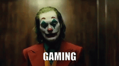 The Joker Is Wearing A Clown Mask And The Word Gaming Is On The Screen . GIF