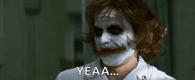 The Joker Is Wearing A Nurse 'S Uniform And A White Mask On His Face . GIF