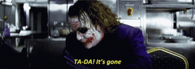 The Joker Says Ta-Da It 'S Gone In A Dark Room . GIF