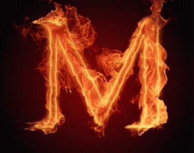 The Letter M Is Made Of Flames On A Dark Background GIF