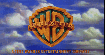 The Logo For Warner Bros. Pictures Against A Blue Sky With Clouds GIF
