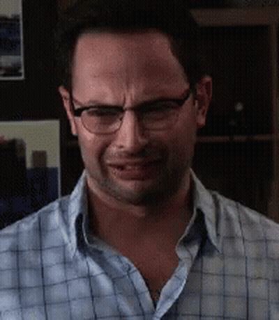 The Man Is Wearing Glasses And A Plaid Shirt GIF