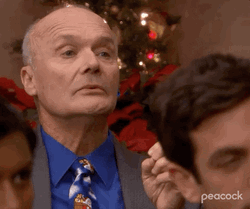 The Office Creed Looking Away At Christmas GIF