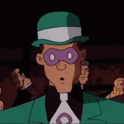 The Riddler From The Batman Animated Series Is Wearing A Green Hat And A Purple Mask . GIF