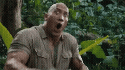 The Rock Is Making A Surprised Face In The Jungle While Holding A Machete . GIF