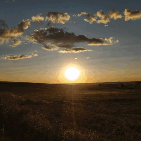 Sunset Over Field With Clouds GIF