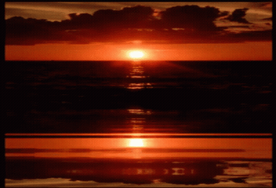 The Sun Is Setting Over The Ocean And The Letters I And J Are Reflected In The Water GIF