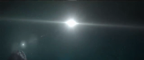 The Sun Is Shining Brightly Behind A Sphere In Space GIF