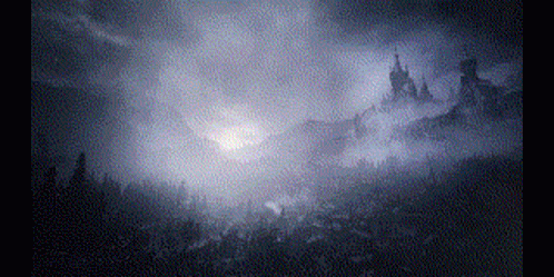 The Sun Is Shining Through The Clouds Over A Forest . GIF