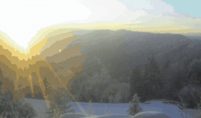 The Sun Is Shining Through The Clouds Over A Snowy Forest GIF