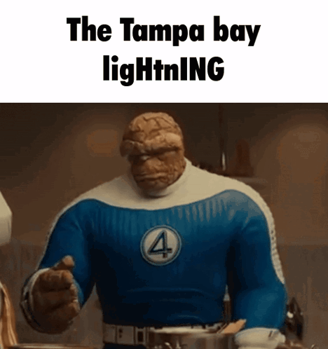 The Thing From The Fantastic Four Is Pointing At The Camera While Wearing A Blue And White Costume . GIF