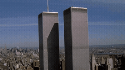 The Twin Towers Of The World Trade Center Are Shown GIF