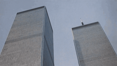 The Twin Towers Of The World Trade Center Are Shown From Below GIF