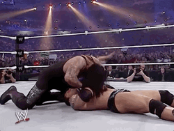 The Undertaker Pushing His Opponent Hands GIF