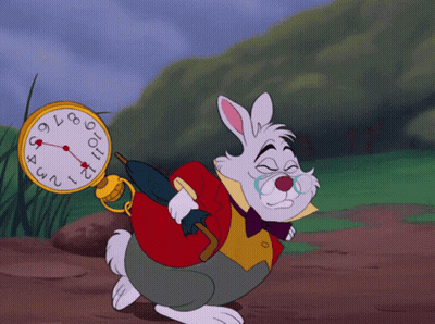 The White Rabbit From Alice In Wonderland Is Holding A Pocket Watch GIF