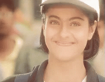 The Woman Is Wearing A Baseball Cap And Smiling . GIF