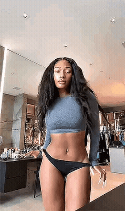 The Woman Is Wearing A Crop Top And Black Underwear . GIF