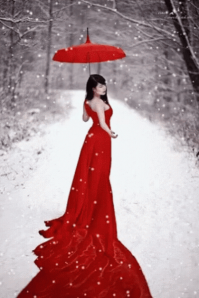 The Woman Is Wearing A Long Red Dress And Holding An Umbrella In The Snow . GIF