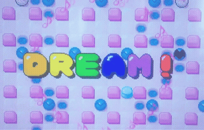 The Word Dream Is Displayed On A Screen Surrounded By Bubbles GIF