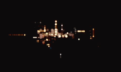The Word Graphic Is Displayed On A Dark Brown Background GIF