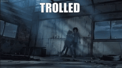 The Word Trolled Is On A Poster With Two People Fighting GIF