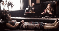 Therapist Talking To Patient Lying On A Sofa GIF