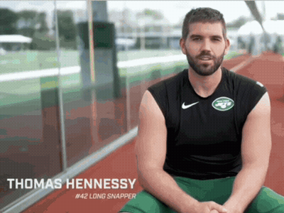 Thomas Hennessy #42 Long Snapper Sitting on Ground