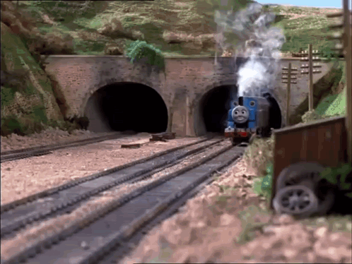 Thomas The Train Is Going Through A Tunnel And Smoke Is Coming Out Of It GIF