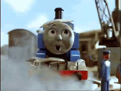 Thomas The Train Is Making A Surprised Face While A Man Stands Next To It . GIF