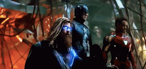 Thor , Captain America , And Iron Man Are Standing Next To Each Other In A Room . GIF