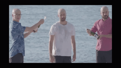 Three Bald Men Holding Bottles GIF