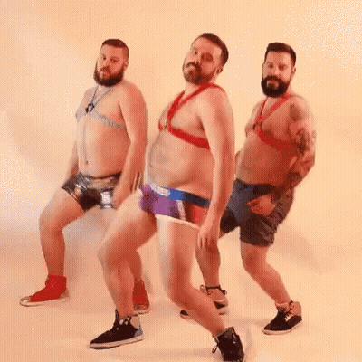 Three Bearded Men Are Dancing Together In Their Underwear And Harnesses . GIF