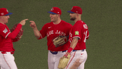 Three Blue Jays Baseball Players Huddled Together GIF