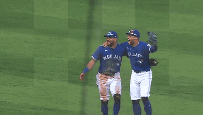Three Blue Jays Baseball Players Hugging GIF