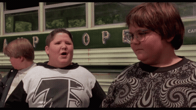 Three Boys Are Standing In Front Of A Bus With The Word Pope On It GIF