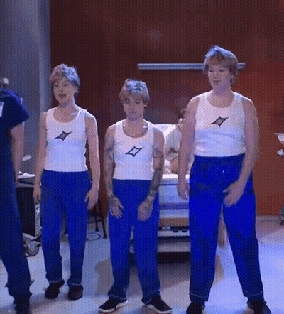 Three Boys In Blue Pants And White Tank Tops Are Dancing GIF