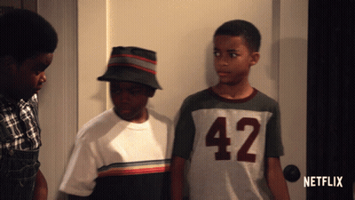 Three Boys Standing in Front of Netflix Door