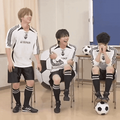 Three Boys Wearing Soccer Uniforms With A Team On The Front GIF