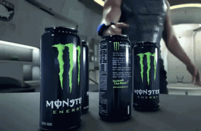 Three Cans Of Monster Energy Drink Are On A Counter GIF