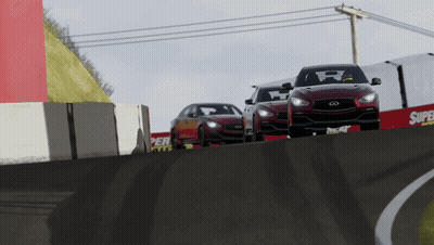 Three Cars Are Driving Down A Race Track With A Super Tires Sign In The Background GIF