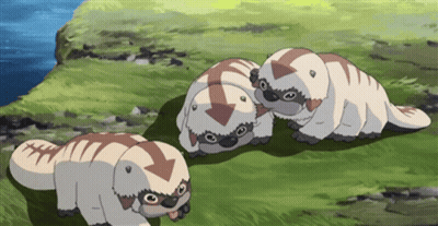 Three Cartoon Animals With Arrows On Their Heads Are Standing In The Grass GIF