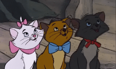 Three Cartoon Cats Are Sitting Next To Each Other With One Wearing A Blue Bow Tie GIF