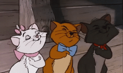 Three Cartoon Cats Are Standing Next To Each Other And One Of Them Is Wearing A Bow Tie GIF