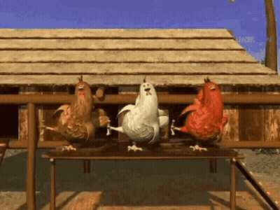 Three Chickens Standing On Table GIF